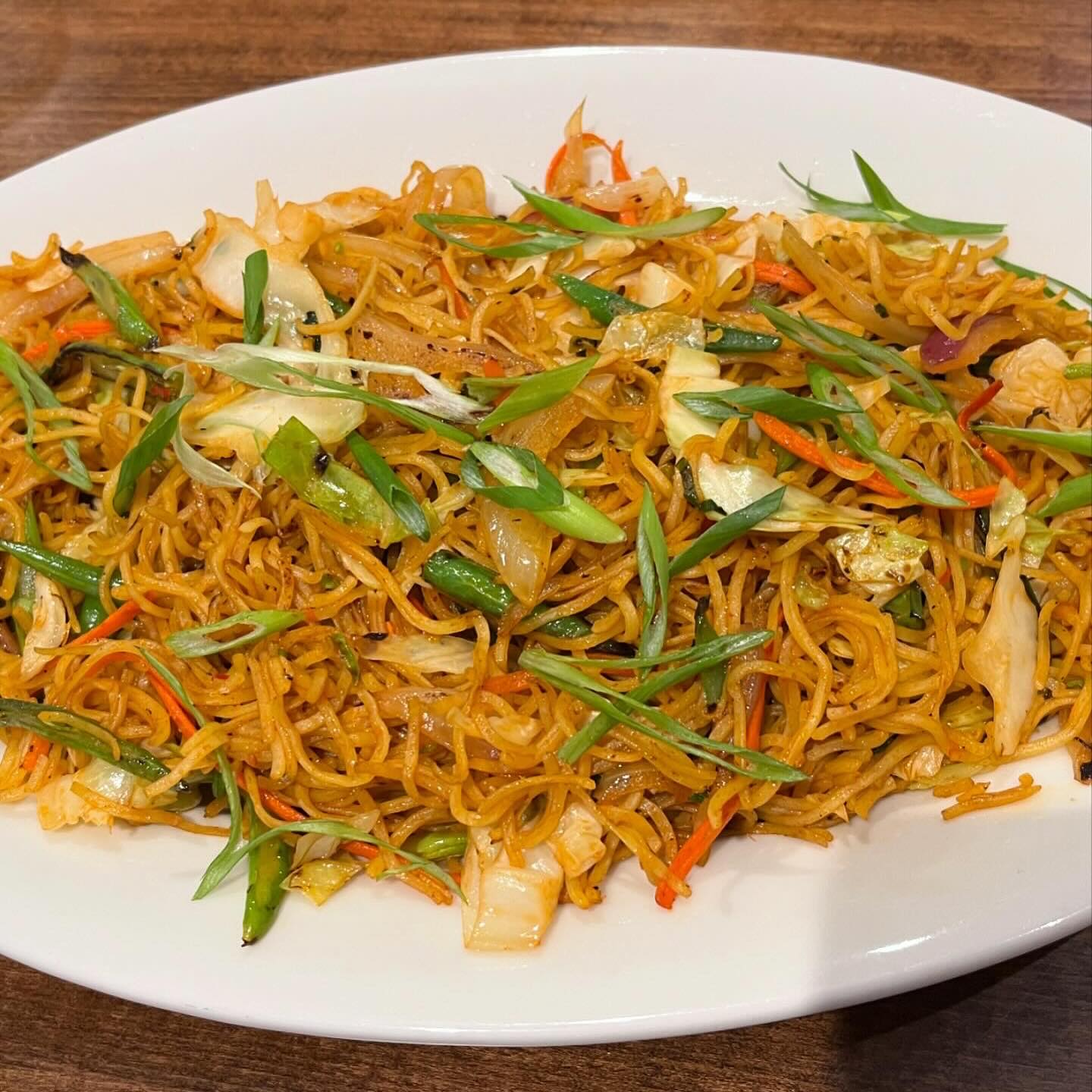 Stir-fried noodles with fresh vegetables and your choice of protein, tossed in savory Himalayan spices.